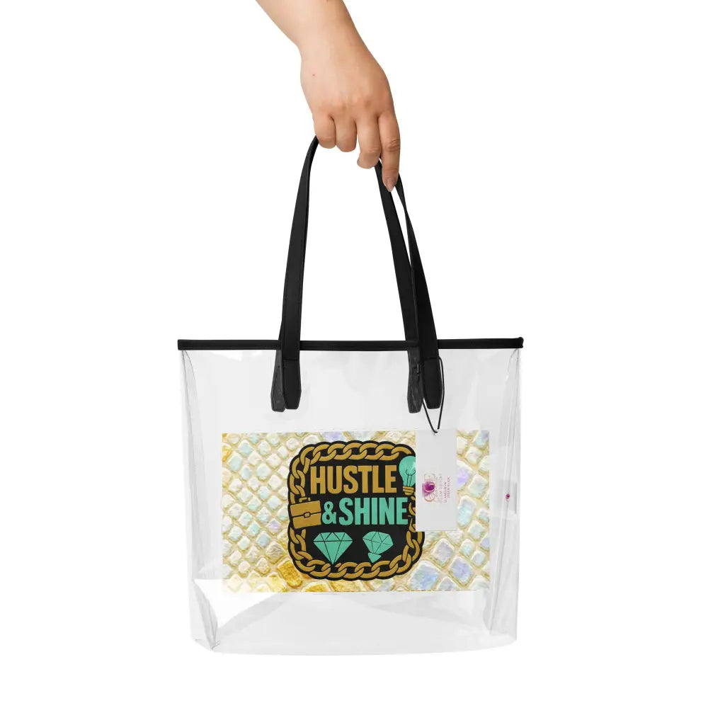 Transparente Tragetasche Hustle & Shine mit schwarzem Griff und Statement-Design